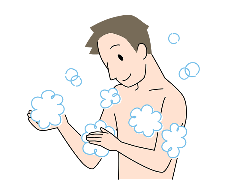 手のひらに泡を作って、腕に滑らせるようにしている30代男性