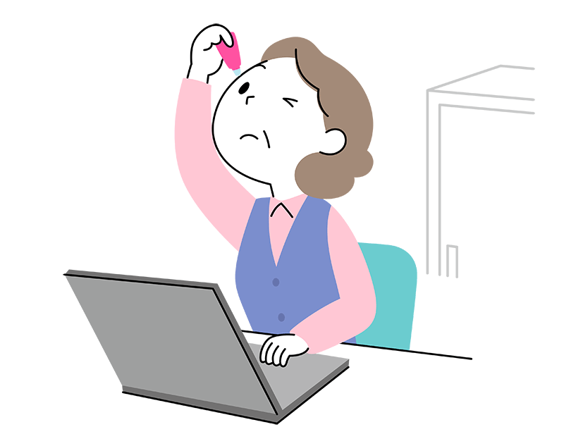 職場のパソコンの前で目薬を差している50代女性