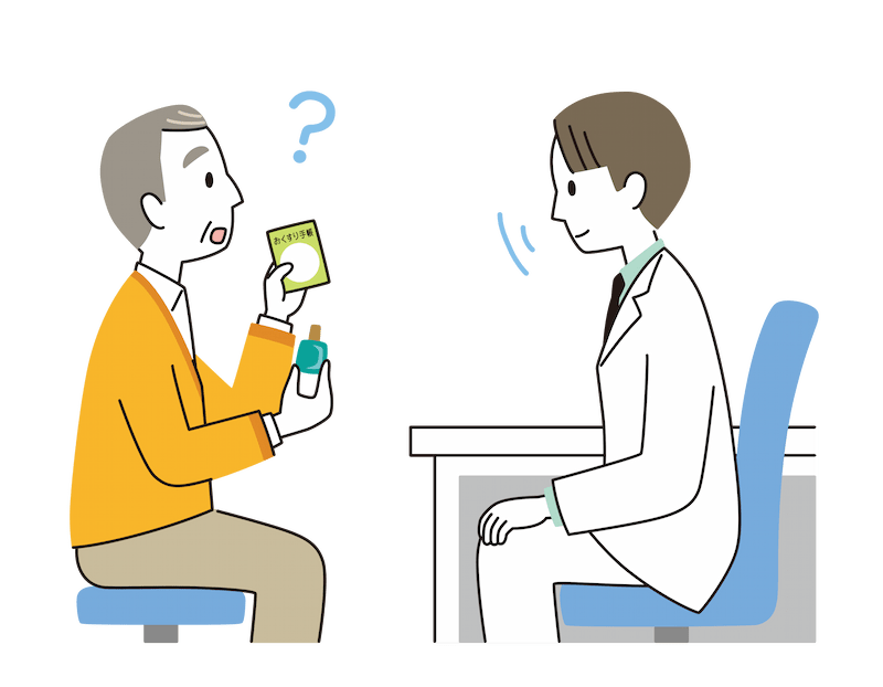 点眼薬とお薬手帳を手にして、眼科の医師に相談をしている様子