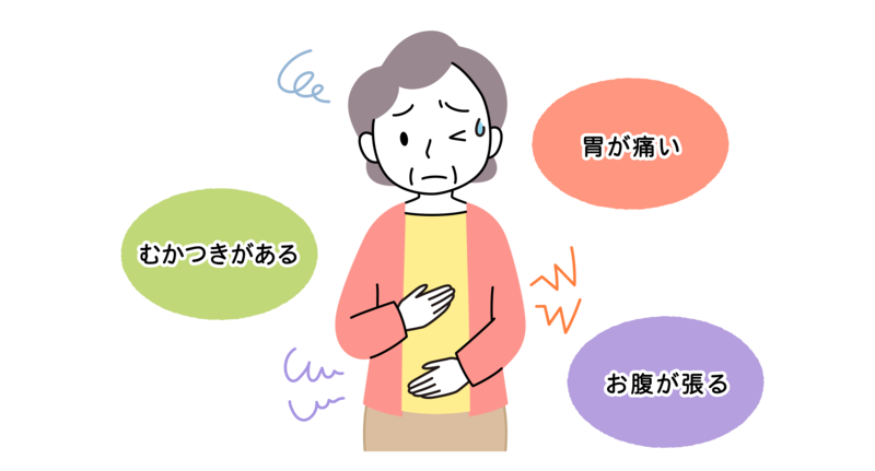 胃の不調で辛そうにしている60代女性
