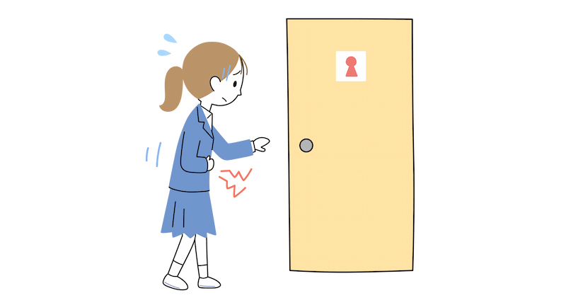 お腹を痛そうに抱えながらトイレに入ろうとする中学生女子