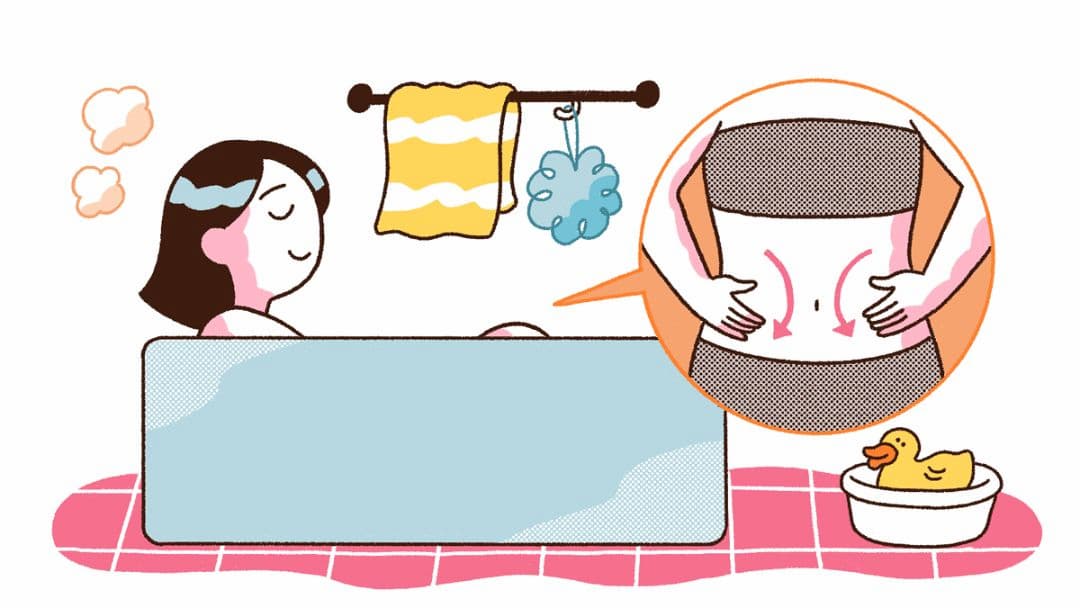 入浴中に腸もみマッサージを行っているイメージ