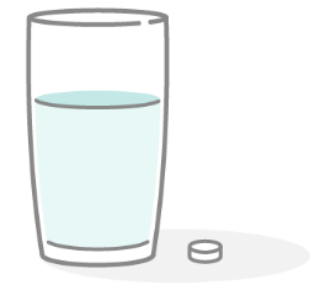 コップ一杯の水と錠剤のイラスト